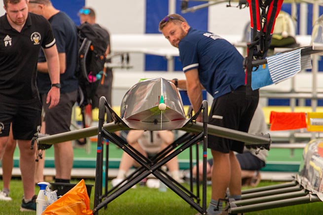 Coaches polishing boat at Henley